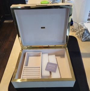 Aerin crocodile and brass jewelry showcase.